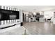 Open concept kitchen with gray cabinets, stainless steel appliances, and view to living area at 4521 W North St, Tampa, FL 33614