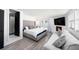 A stylish main bedroom with access to the outdoors offers a contemporary aesthetic at 4521 W North St, Tampa, FL 33614