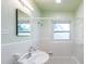 Clean bathroom with a classic white tub, tile surround, and a large mirror at 4611 17Th N Ave, St Petersburg, FL 33713