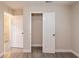 Bedroom featuring wood-look tile floors, neutral walls, and a closet with a white bi-fold door at 4611 17Th N Ave, St Petersburg, FL 33713
