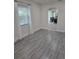 Dining room showcasing large window, gray tile flooring and arched doorway at 4611 17Th N Ave, St Petersburg, FL 33713