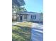 Charming single-story home featuring a cozy front porch and well-maintained lawn at 4611 17Th N Ave, St Petersburg, FL 33713