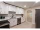 Bright kitchen featuring white cabinets, modern appliances, and an open layout at 4611 17Th N Ave, St Petersburg, FL 33713