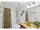Bathroom featuring tub/shower combo, vanity, mirror, and lighting at 512 Hillpine Way, Brandon, FL 33510