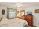 Bedroom with bed, side table, dresser and a TV at 512 Hillpine Way, Brandon, FL 33510