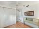 Bedroom featuring wood floors, closet, and access to the bathroom at 512 Hillpine Way, Brandon, FL 33510