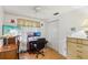 Bedroom featuring desk area, ceiling fan, window, and a closet at 512 Hillpine Way, Brandon, FL 33510
