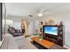 Comfortable living room with a ceiling fan, a sofa, and entertainment center at 512 Hillpine Way, Brandon, FL 33510