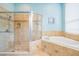 Bathroom with glass shower, bathtub, vanity, and granite countertop at 5156 Pinnacle Dr, Oldsmar, FL 34677