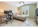 Bedroom with neutral walls and vaulted ceiling, wooden desk and rolling chair at 5156 Pinnacle Dr, Oldsmar, FL 34677