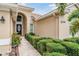 Inviting front entrance with decorative door, manicured hedges and tile walkway to front door at 5156 Pinnacle Dr, Oldsmar, FL 34677