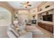 Spacious living room features neutral tones, fireplace, and views of the front entryway at 5156 Pinnacle Dr, Oldsmar, FL 34677