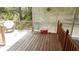 Wooden back porch with white lattice fencing and plenty of room for outdoor seating at 5287 Azalea Cir, Dade City, FL 33523