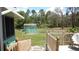 Back porch with steps leading to the backyard at 5287 Azalea Cir, Dade City, FL 33523