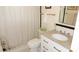 Bathroom featuring a toilet, shower with patterned curtain, and vanity with granite countertop and chrome hardware at 5287 Azalea Cir, Dade City, FL 33523