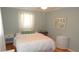 Charming bedroom with neutral walls, a comfy bed, and bright natural light at 5287 Azalea Cir, Dade City, FL 33523
