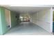 Large carport area with overhead covering and open lattice fencing at 5287 Azalea Cir, Dade City, FL 33523