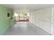 Enclosed carport offering sheltered parking and additional storage space at 5287 Azalea Cir, Dade City, FL 33523
