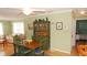 Cozy dining room with wood table, chairs, hardwood floors, and a quaint hutch at 5287 Azalea Cir, Dade City, FL 33523