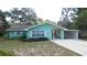 Well-maintained single-Gathering home with a neatly kept lawn and convenient carport at 5287 Azalea Cir, Dade City, FL 33523