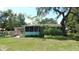 Exterior view of the house with a large backyard at 5287 Azalea Cir, Dade City, FL 33523