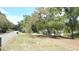 Spacious lot with grass and trees at 5287 Azalea Cir, Dade City, FL 33523