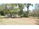 View of the grounds surrounding the house, with mature trees and open spaces at 5287 Azalea Cir, Dade City, FL 33523
