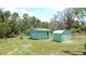 Two storage sheds in the backyard at 5287 Azalea Cir, Dade City, FL 33523