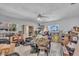 An unfinished basement with potential, featuring a ceiling fan and natural light from two windows at 5713 Shore S Blvd, Gulfport, FL 33707