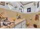 Bathroom with charming tilework, vintage fixtures, and ample counter space at 5713 Shore S Blvd, Gulfport, FL 33707