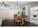 Dining room with slate floors, decorative lighting, and an adjacent updated kitchen visible in the background at 60 Lakeview Ct, Palm Harbor, FL 34683