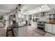 Bright kitchen with granite counters, stainless appliances, and white cabinets, offering a modern cooking space at 60 Lakeview Ct, Palm Harbor, FL 34683