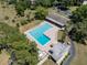 Aerial view of a community pool with lounge chairs and ample space for relaxing and enjoying the sun at 60 Lakeview Ct, Palm Harbor, FL 34683