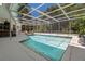 An inviting swimming pool with a screened-in enclosure for year-round enjoyment at 60 Lakeview Ct, Palm Harbor, FL 34683