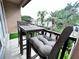 Cozy balcony with outdoor seating, offering a relaxing space with lush tropical views at 612 Arbor Lake Ln, Tampa, FL 33602