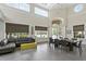 Bright clubhouse featuring high ceilings, large windows, stylish furniture, and a spacious seating and dining area at 612 Arbor Lake Ln, Tampa, FL 33602