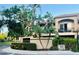 Exterior view of Island Walk Private Residences sign, landscape, and building at 612 Arbor Lake Ln, Tampa, FL 33602