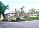 Exterior view of Island Walk private residences, showcasing the architecture, landscaping, and tropical palm trees at 612 Arbor Lake Ln, Tampa, FL 33602