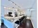 Modern kitchen with white cabinetry, stainless steel appliances, and a beautiful marble waterfall island with seating at 612 Arbor Lake Ln, Tampa, FL 33602