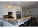 Modern kitchen with granite countertops, stainless steel appliances, and breakfast bar seating at 612 Arbor Lake Ln, Tampa, FL 33602