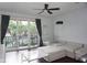 Bright living room with hardwood floors, modern furnishings, and sliding doors that lead to a balcony at 612 Arbor Lake Ln, Tampa, FL 33602