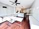 Open floor plan combining living room and kitchen with hardwood floors and modern furnishings at 612 Arbor Lake Ln, Tampa, FL 33602