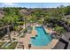 Beautiful pool area surrounded by lounge chairs and lush landscaping at Island Walk private residences at 612 Arbor Lake Ln, Tampa, FL 33602