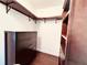 Spacious walk-in closet featuring wood cabinets, shelving and drawers for ample storage at 612 Arbor Lake Ln, Tampa, FL 33602
