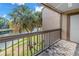 Balcony overlooking water with tropical landscaping at 6309 Newtown Cir # 9B2, Tampa, FL 33615