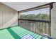 Screened-in balcony overlooking water and trees for scenic outdoor relaxation at 6309 Newtown Cir # 9B2, Tampa, FL 33615
