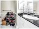 Vanity in bathroom with black countertop, white cabinets, and storage for shoes at 6309 Newtown Cir # 9B2, Tampa, FL 33615