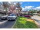 Street view of townhomes featuring parking, landscaping, and balconies, with a view of the surrounding neighborhood at 6309 Newtown Cir # 9B2, Tampa, FL 33615