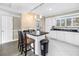 This kitchen includes a breakfast bar with pendant lighting at 6309 Newtown Cir # 9B2, Tampa, FL 33615