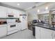 Bright kitchen with white cabinets and modern appliances at 6309 Newtown Cir # 9B2, Tampa, FL 33615